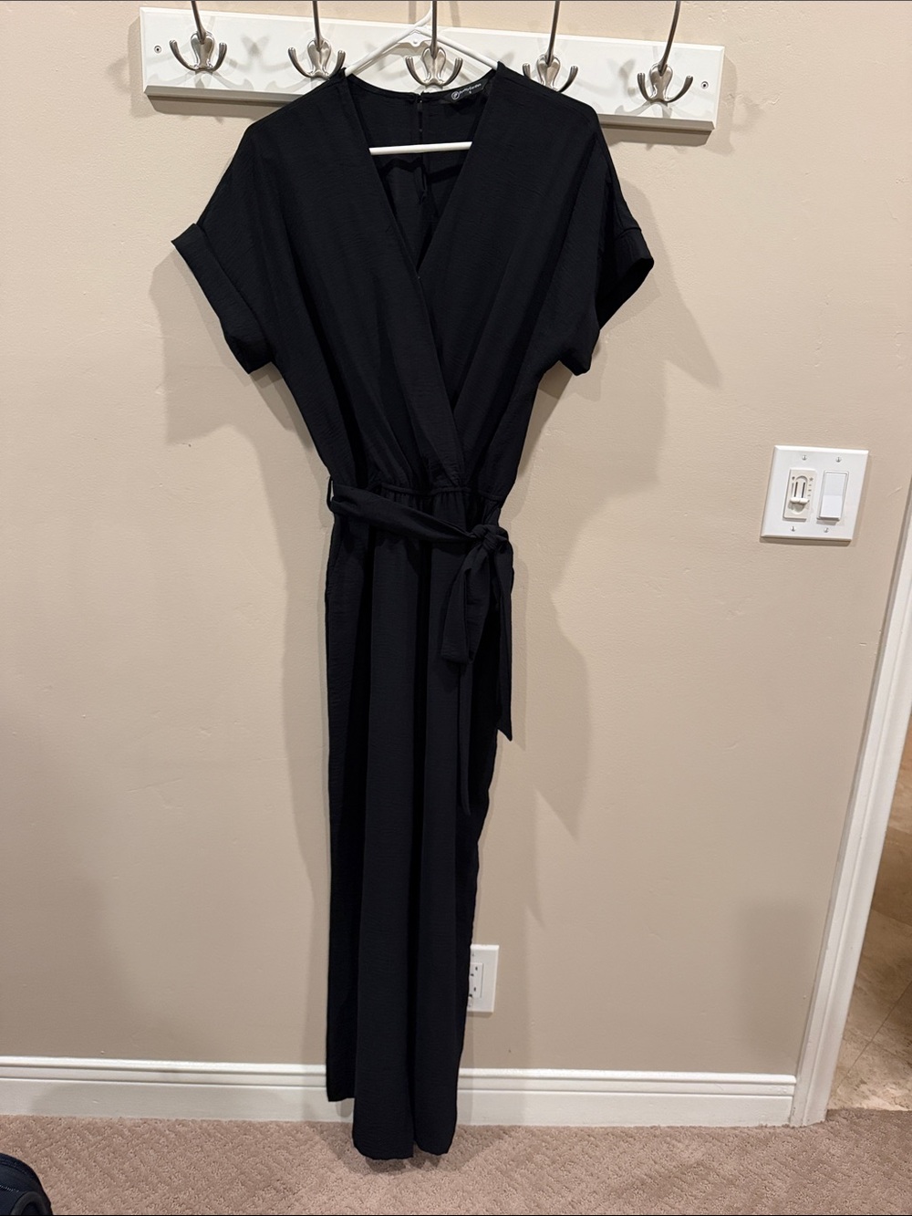 PrettyGarden Black Faux Wrap Wide Leg Jumpsuit Size S  Pockets and a Tie Waist
